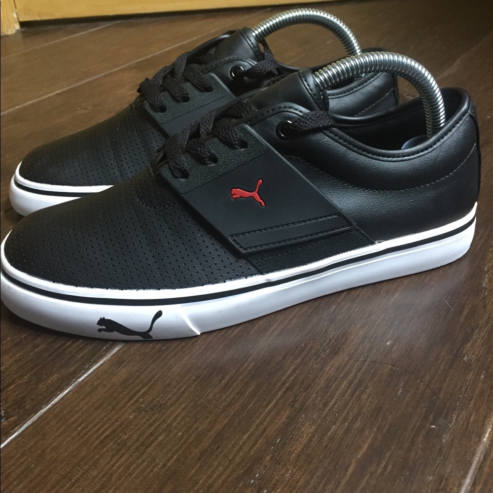 Puma Black Low-Top Sneakers with Red Logo and White Sole